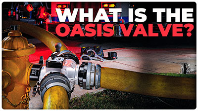 An oasis fire hydrant assist valve with firefighting equipment in the background
