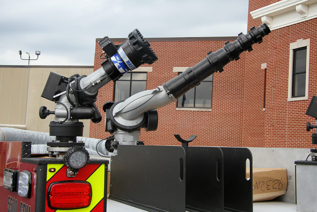 Two Monsoon monitors with different nozzles mounted on top of a firefighting pumper