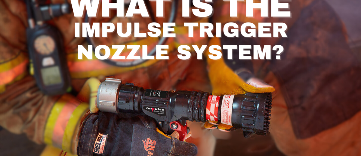A firefighter holds a nozzle with the impulse trigger nozzle system.