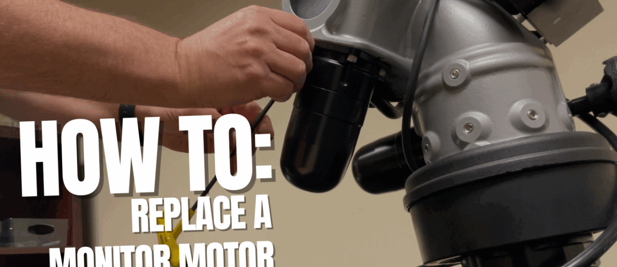 A Hand Reaches Toward The Motor Of A Tft Firefighting Monitor During A Tft Monitor Motor Replacement