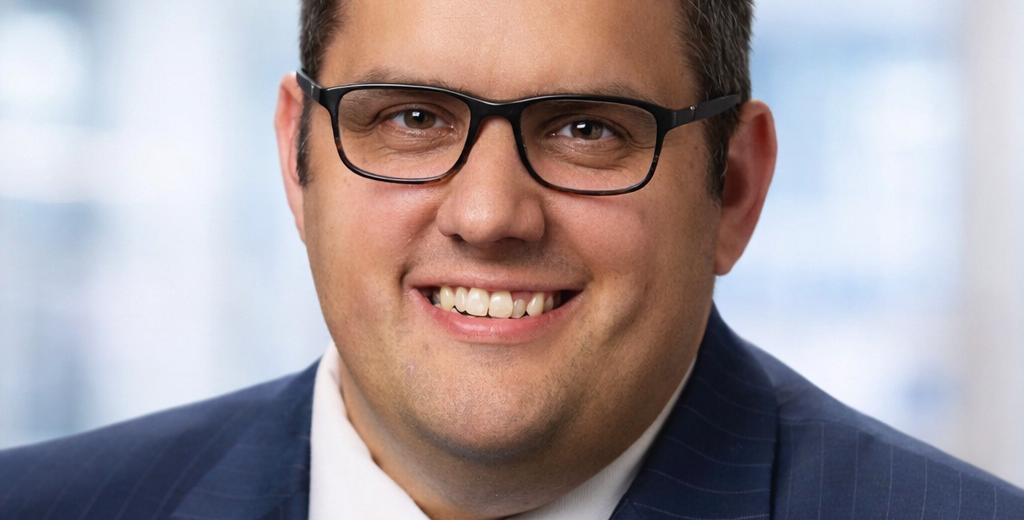 Joe Justak Headshot e1773420923195