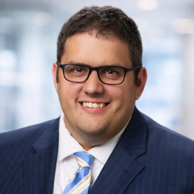 Joe Justak Headshot e1773420923195